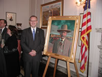 Sen. Henry with painting of Bill Tilghman.