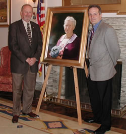 Sen. Charles Ford and Artist Mike Wimmer with portrait of Miss Alice Robertson.