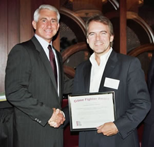 State Senator Jonathan Nichols (R-Norman) receiving a National Crime Fighter Award and being congratulated by the keynote speaker U.S. Congressman Dave Reichert (R-WA).