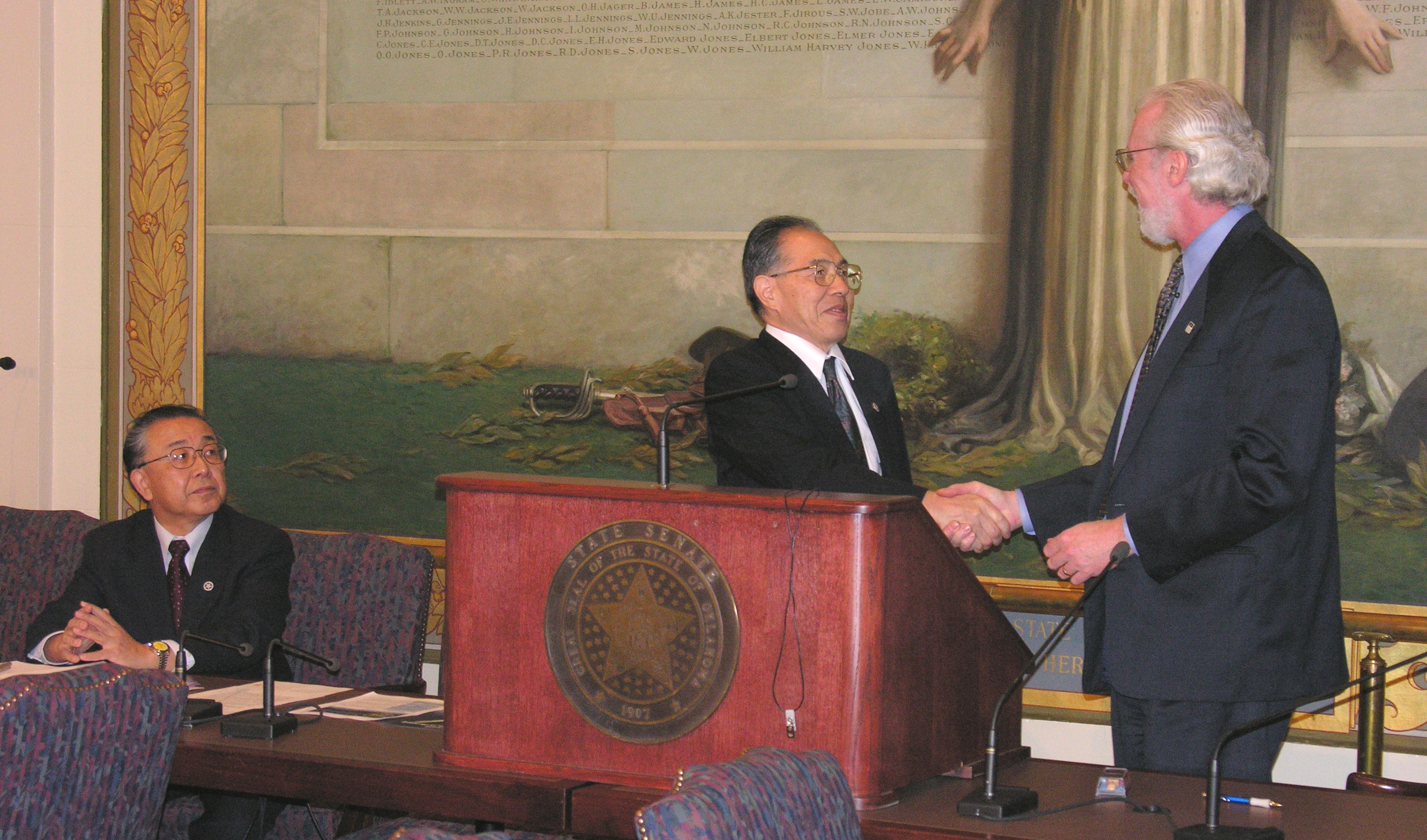Rocketplane's Director of Business Development Charles Lauer and HASTIC officials sign agreement at State Capitol.