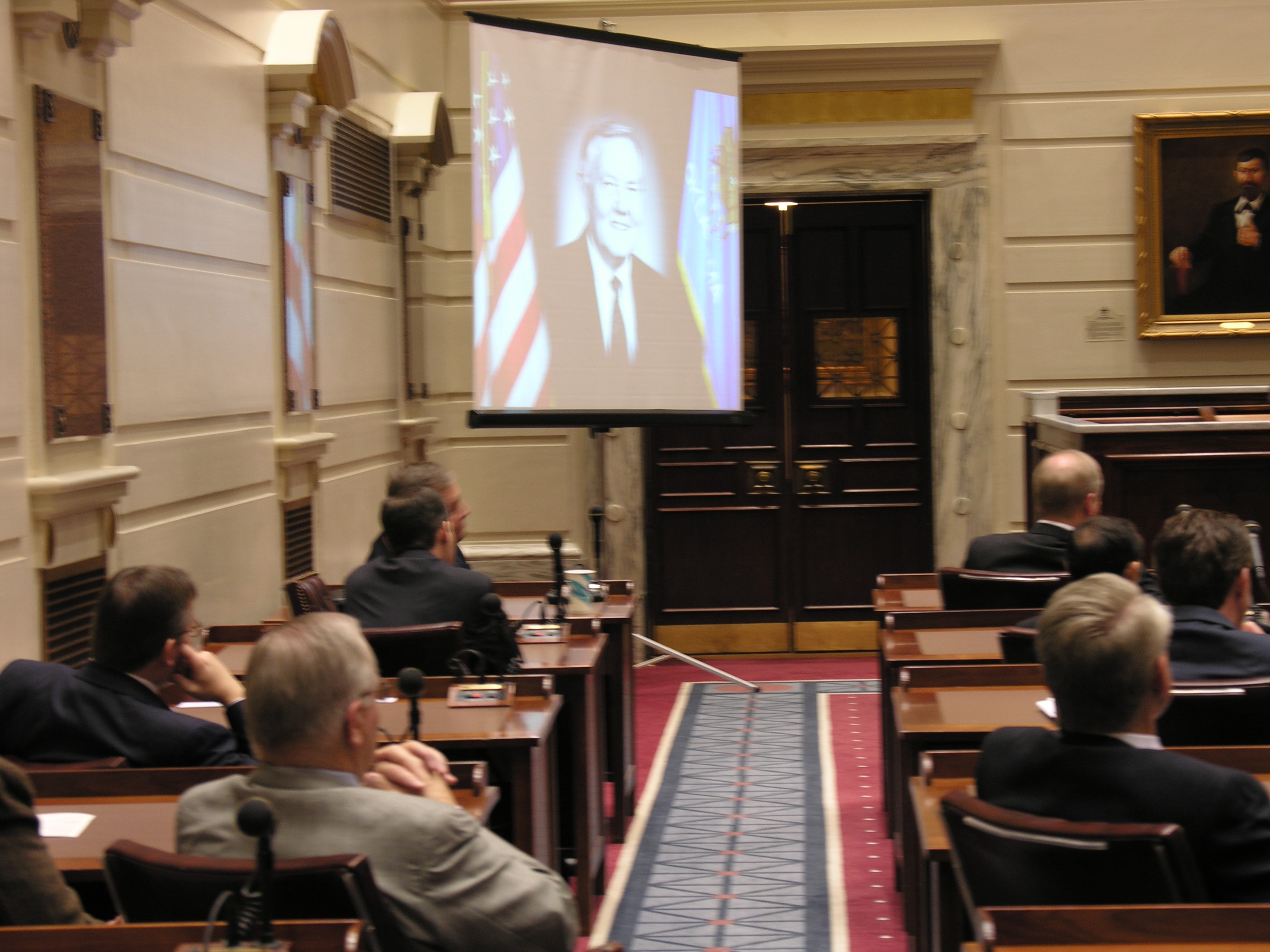 A photo of Senator Kerr is projected on a screen in the Senate Chamber during a Celebration of Life ceremony held in his honor Monday morning.