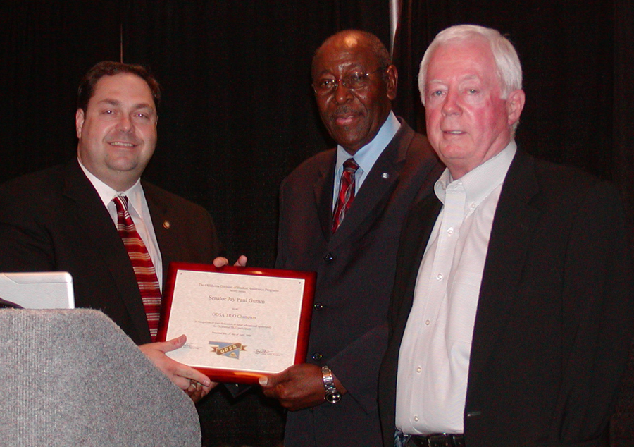 Sen. Jay Paul Gumm receives the "Champion of TRIO" Award from Al White during a recent ceremony in Oklahoma City.  Joining White in making the presentation is Paul Risser, chancellor of Oklahoma's higher education system.  