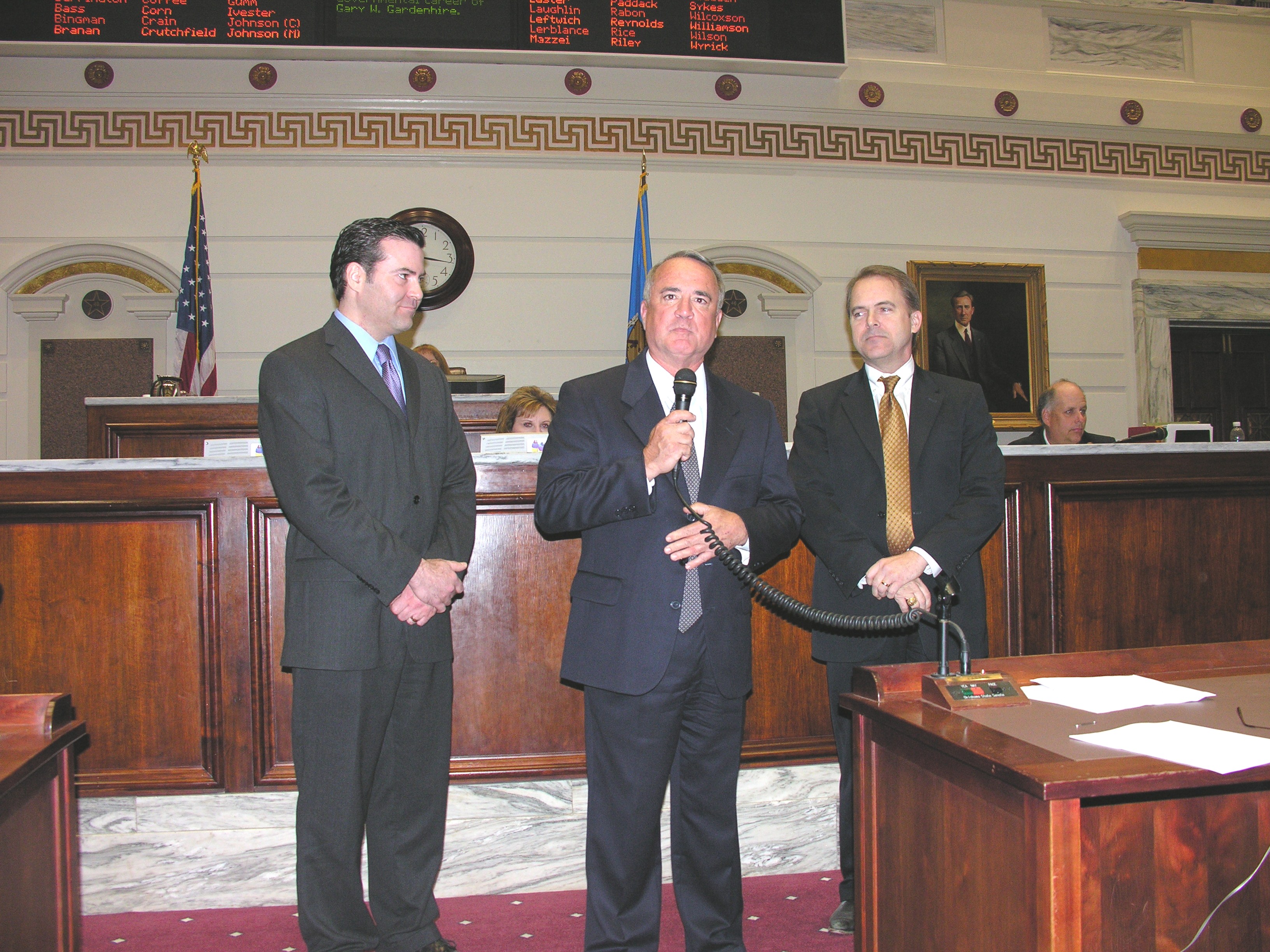 Former Senator Gary Gardenhire addresses the State Senate on Wednesday, with Senator Jonathan Nichols at right and son Damon Gardenhire on left.