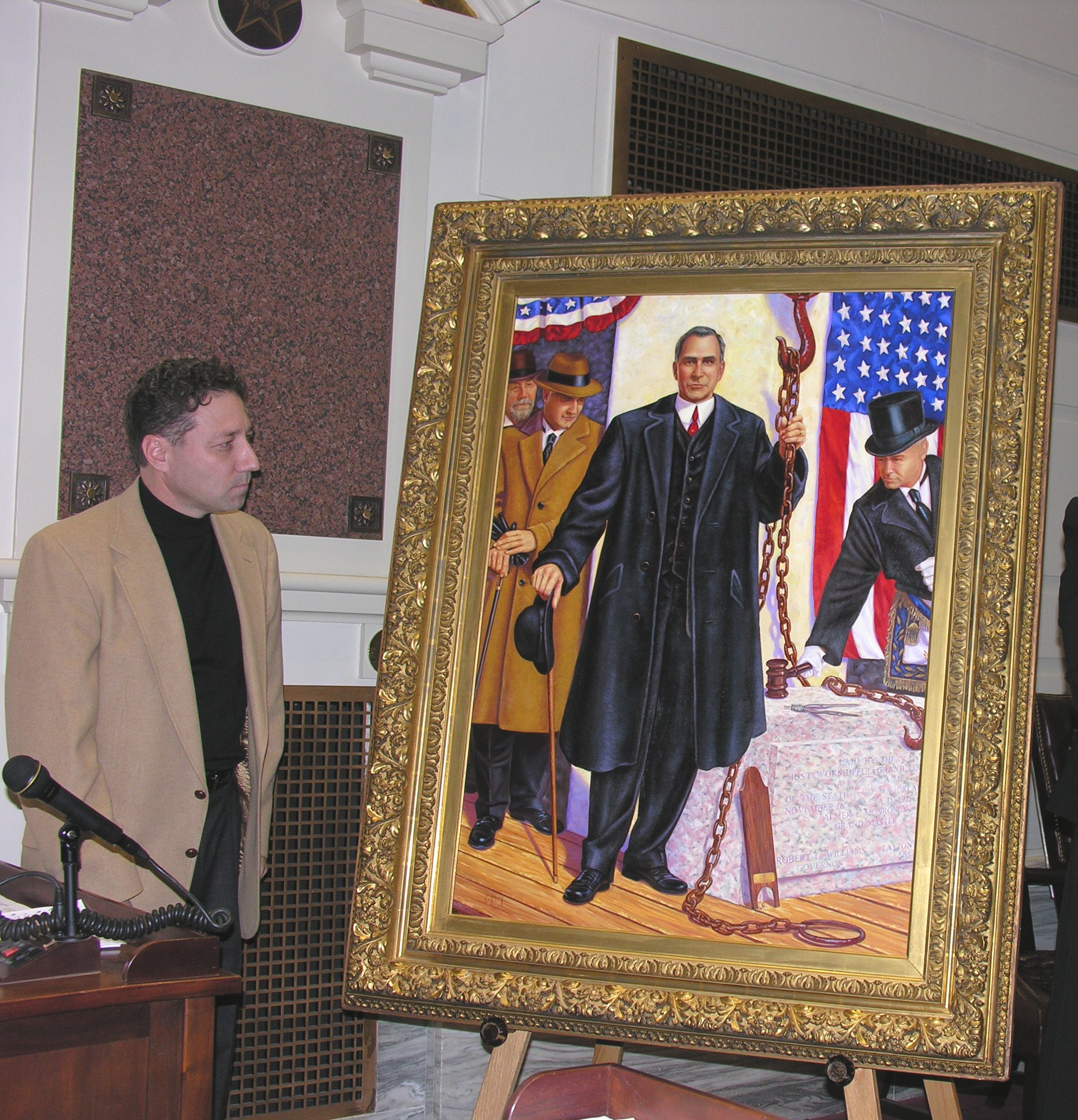 Artist Christopher Nick looks at his painting following its unveiling in the Senate Chamber Tuesday.