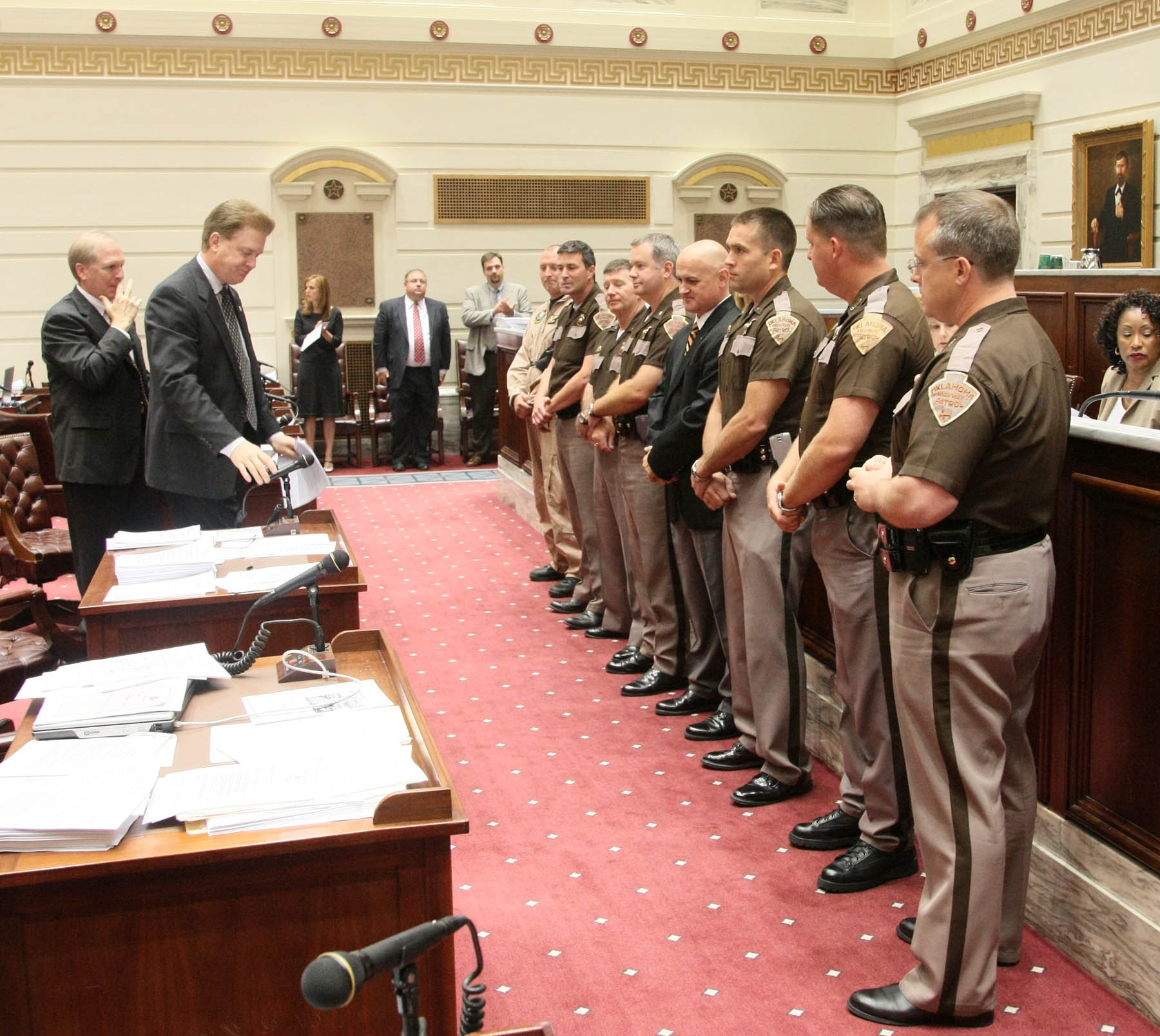 Sen. Laster reaches for the microphone as the Senate honors members of the Highway Patrol.
