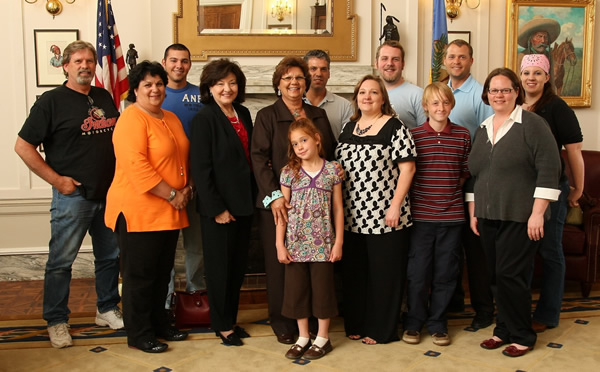 Sen. Mary Easley poses with the children and grandchildren of Oklahoma sculptor Willard Stone following the reading of SCR 11 honoring his life and works. 