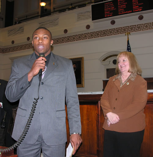 2009 Jim Thorpe Award winner Eric Berry addresses the State Senate alongside Sen. Debbe Leftwich.