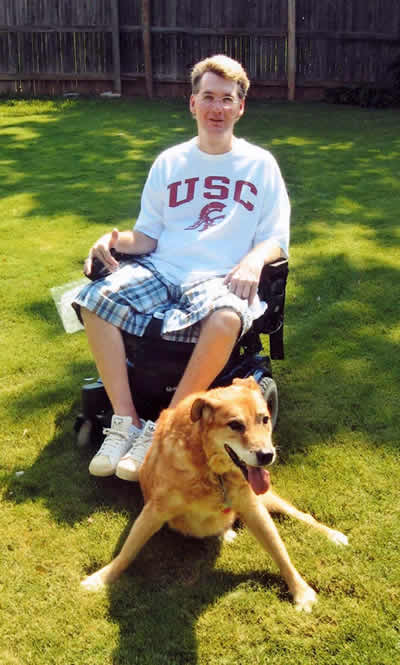 Charles and his beloved companion and service dog Hobbs at their home.