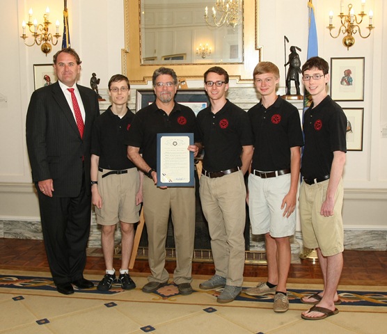 Sen. John Sparks is pictured with Norman Public Schools Advanced Robotics, winners of six consecutive state and regional championships. The team has been ranked third in the world in 2012 and 2011 Botball competition.