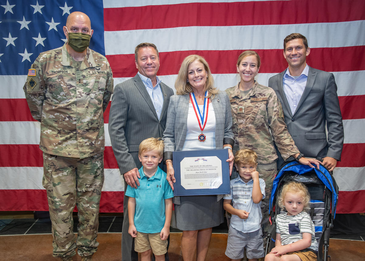 Senate Majority Leader Kim David receives the Oklahoma Medal of Freedom. Left to Right, Maj. Gen. General Thompson, Adjutant General for the Oklahoma National Guard, Sen. David’s husband, Dan David, Sen. David, her daughter, Maj. Jamie Underwood, husband Jeff Underwood and their children, Luke, Will, and Oliver Underwood.