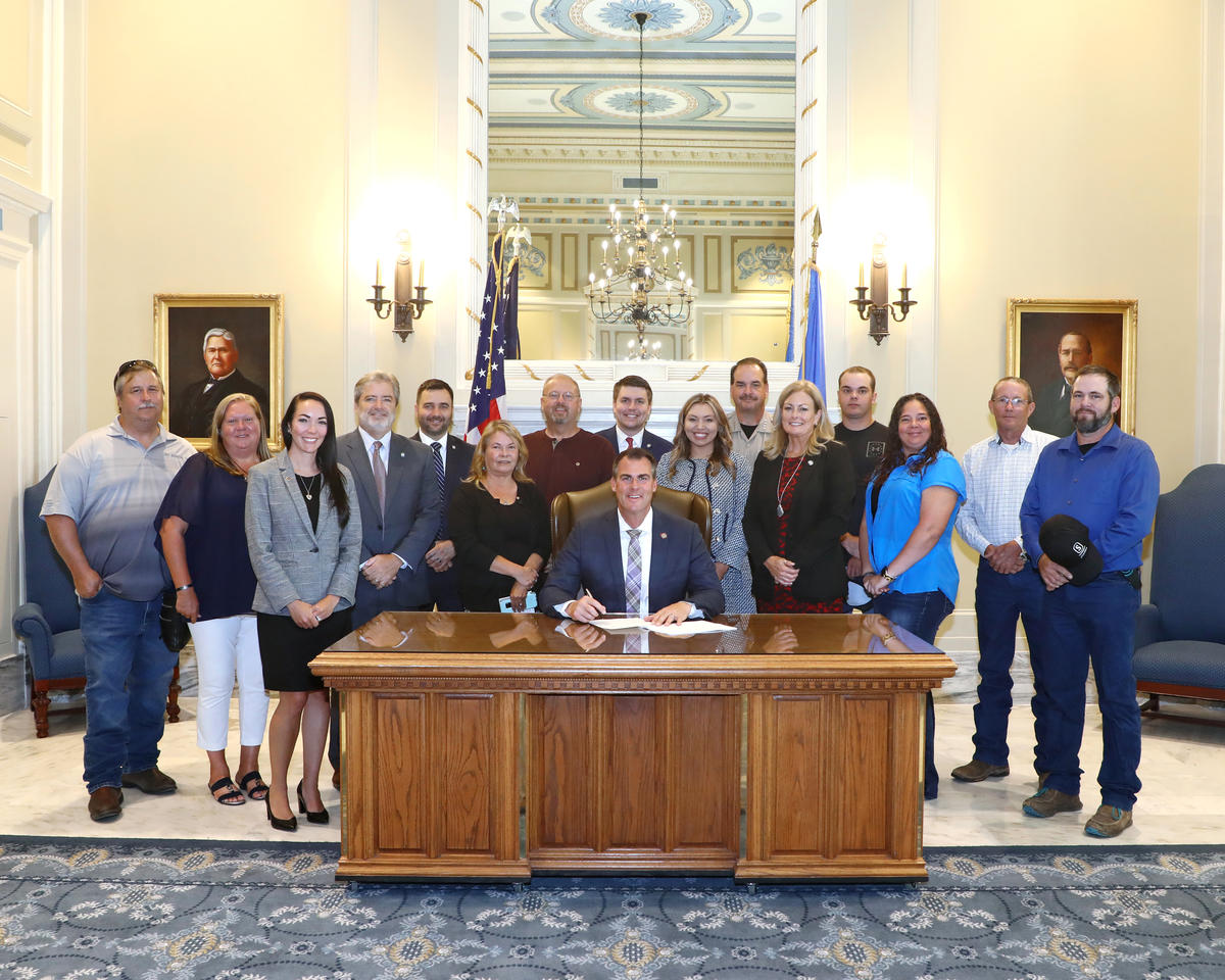 Sen. Kim David, R-Porter, and Gov. Stitt held a ceremonial signing recently for SB 624, renaming a section of State Highway 51B in Porter as the “Lieutenant Eugene Smith Memorial Highway”. They were joined by Smith’s children, Eugene, Mathew and Billie Smith as well as Wagoner County Sheriff Chris Elliott and former deputy Doug Grammar. Several of Smith’s grandchildren and other family members were also present for the ceremonial signing. Also pictured are the bill’s co-authors Sen. Rob Standridge, R-Norman