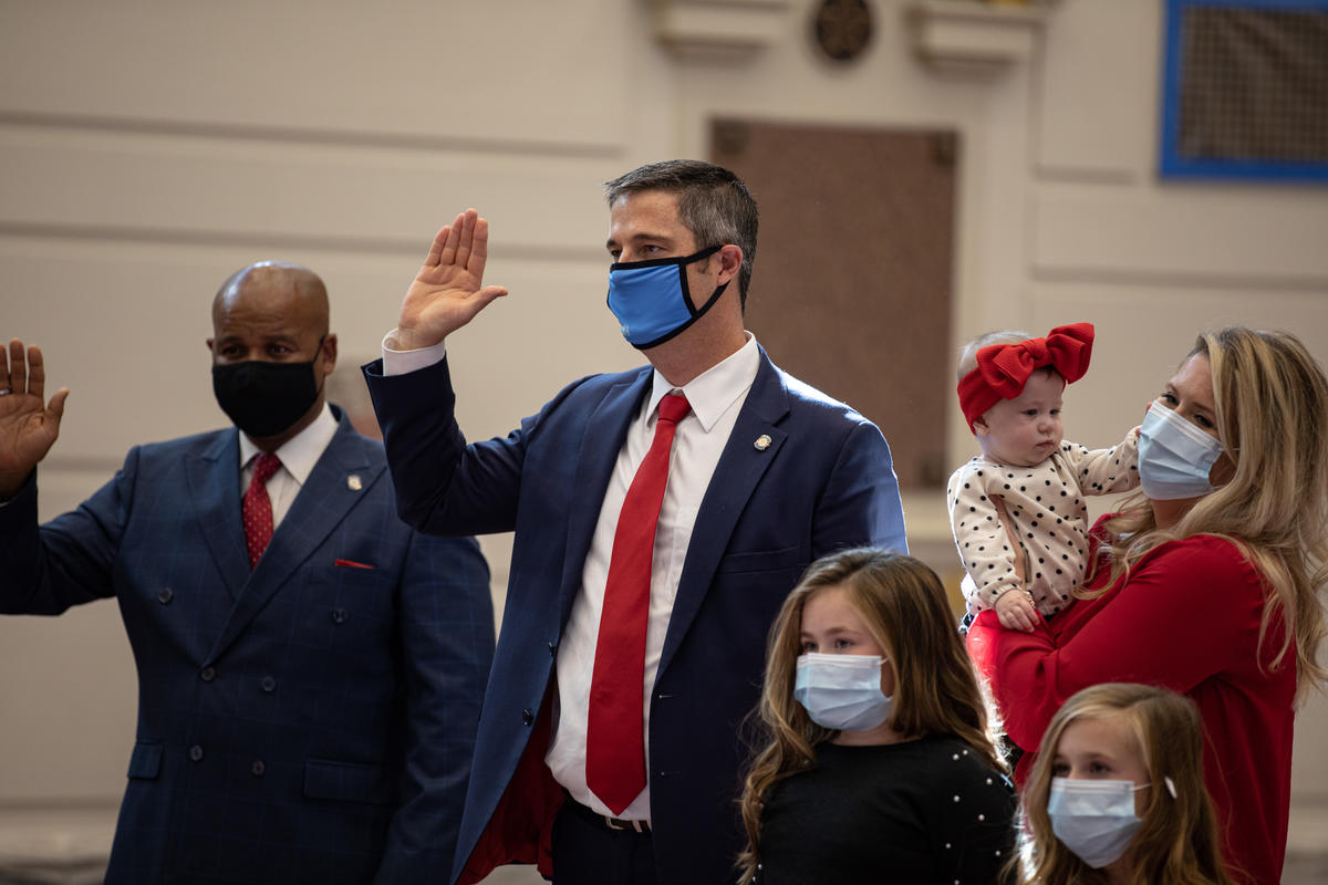 Sen. Kidd takes the oath of office with his family Monday in the Senate Chamber.