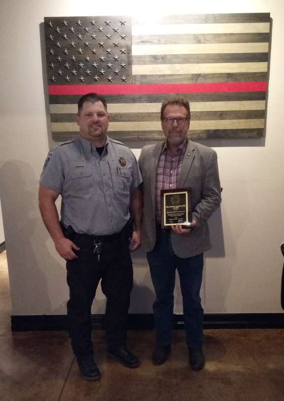 Craig County Sheriff Heath Winfrey (left) visits with Sen. Micheal Bergstrom, R-Adair, at the  2018 Oklahoma Legislator of the Year Awards program on September 24. 