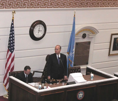 Senator Taylor, author of the Texas Plan, presides over action on the Senate floor.