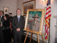 Sen. Henry with painting of Bill Tilghman.