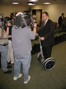 Sen. Coffee Talks to the Press about his legislation regulating Human Transporters