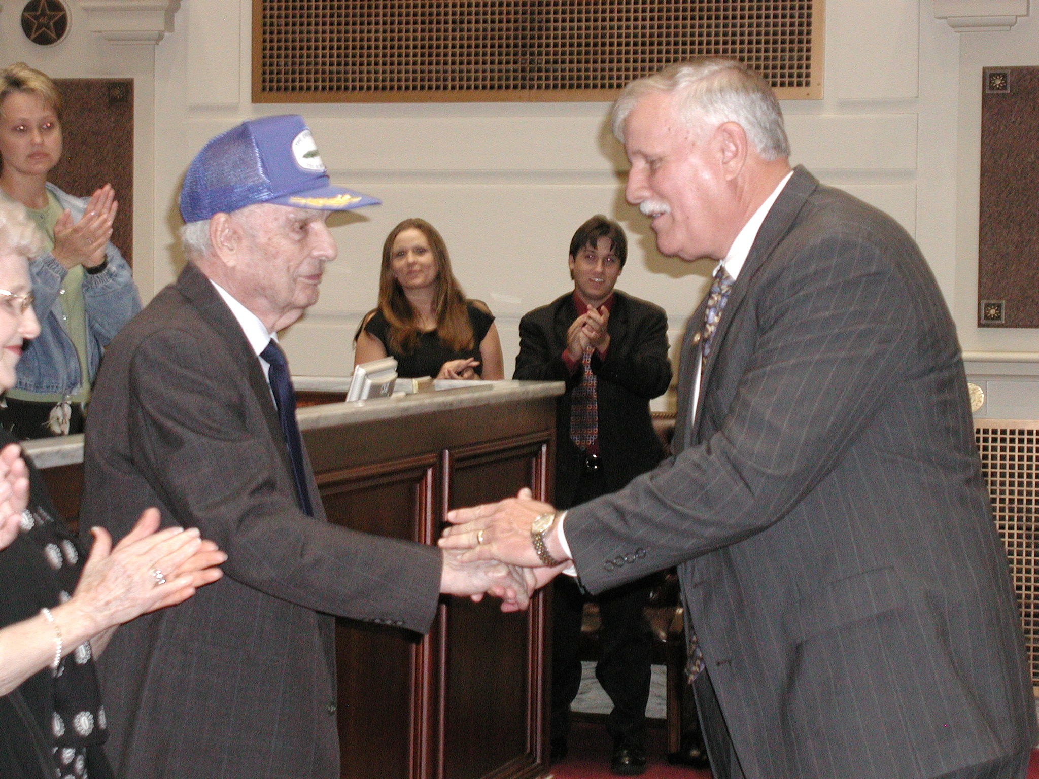 Sen. Garrison thanks Col. Hill for his years of service following the reading of the resolution.