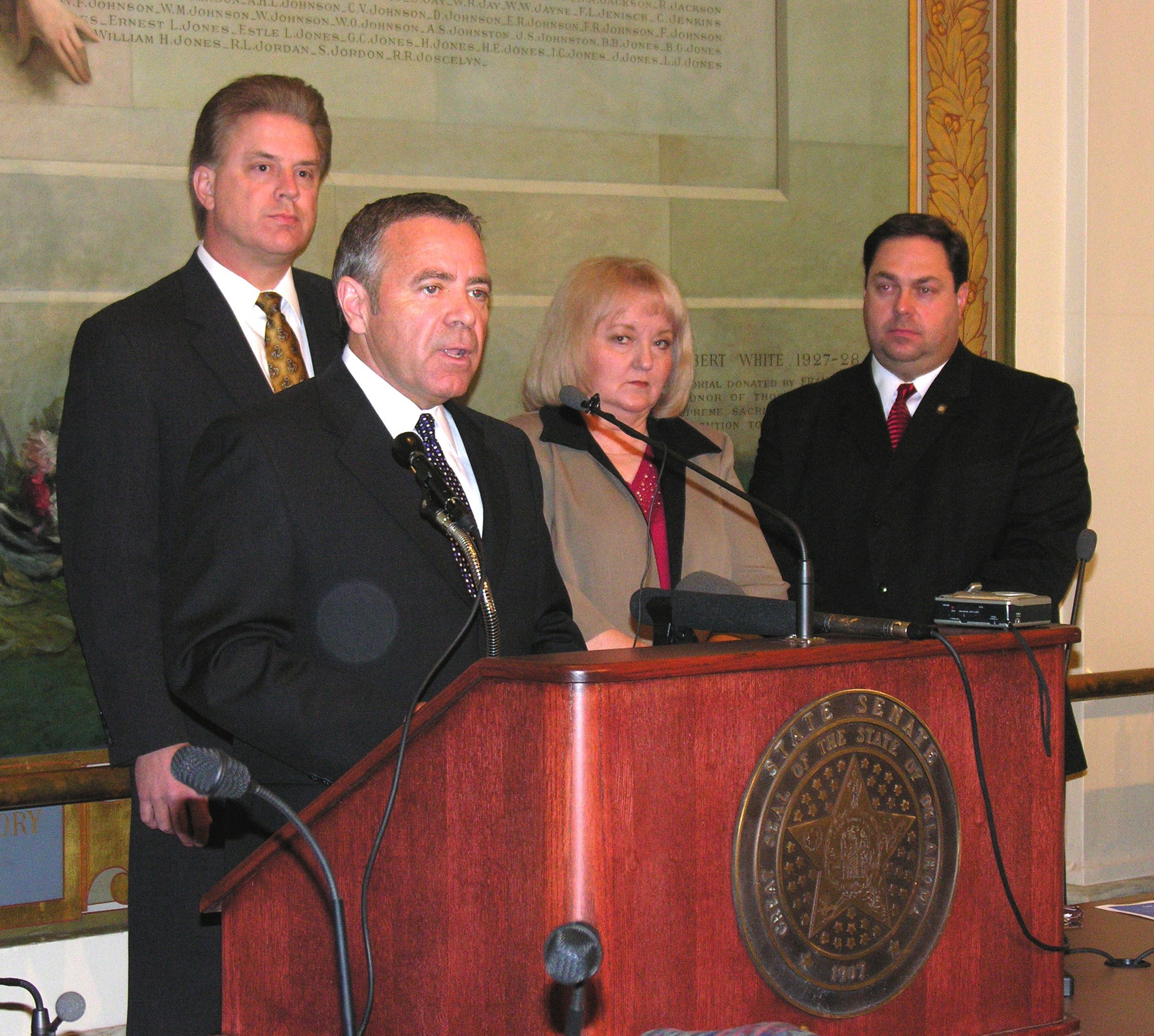 Senate President Pro Tem Mike Morgan and Senators Charlie Laster, Debbe Leftwich and Jay Paul Gumm discuss Senate Democrat proposals at a State Capitol press conference on Tuesday.