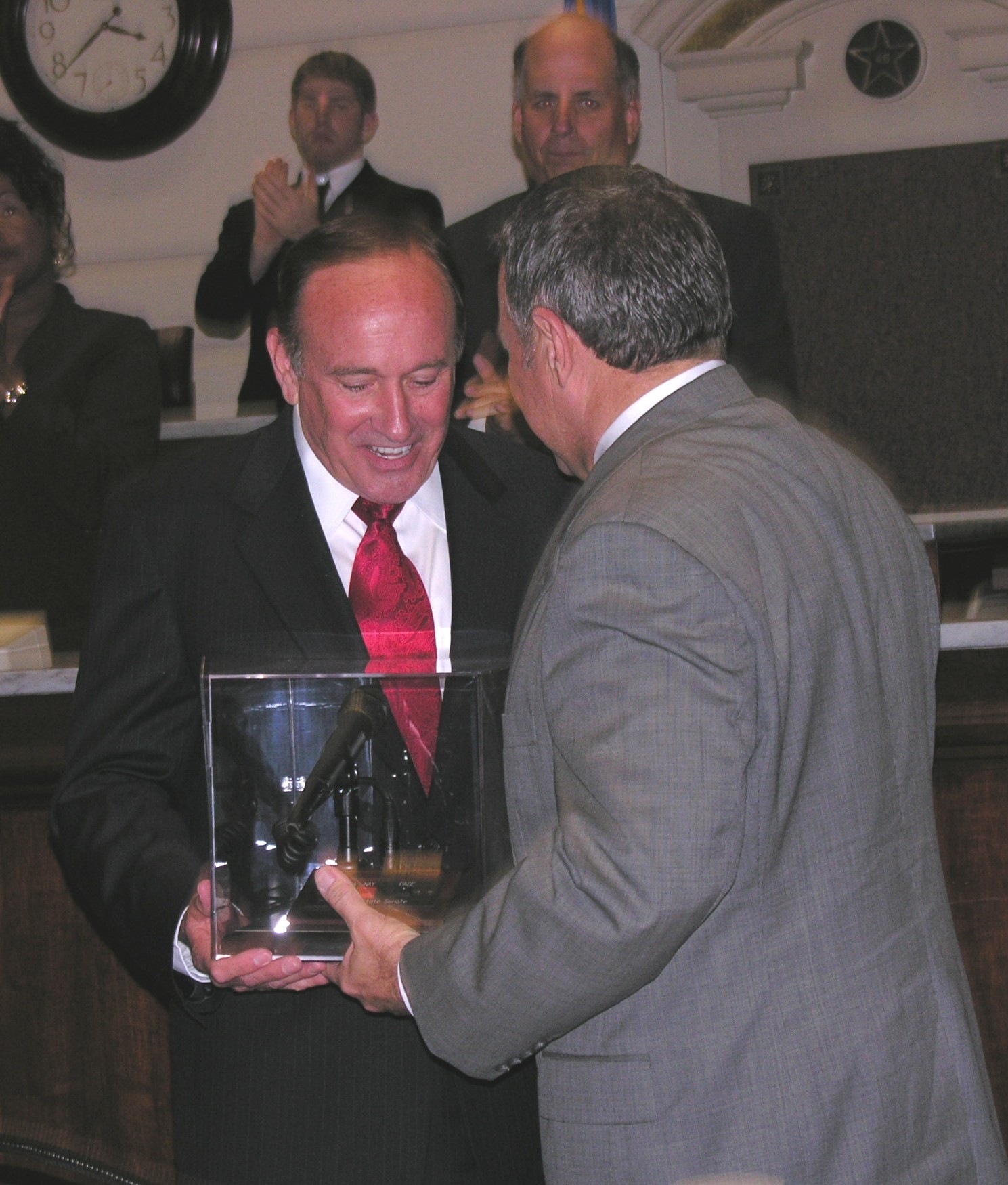 President Pro Tem Mike Morgan presents Senator Cal Hobson with his Senate microphone.