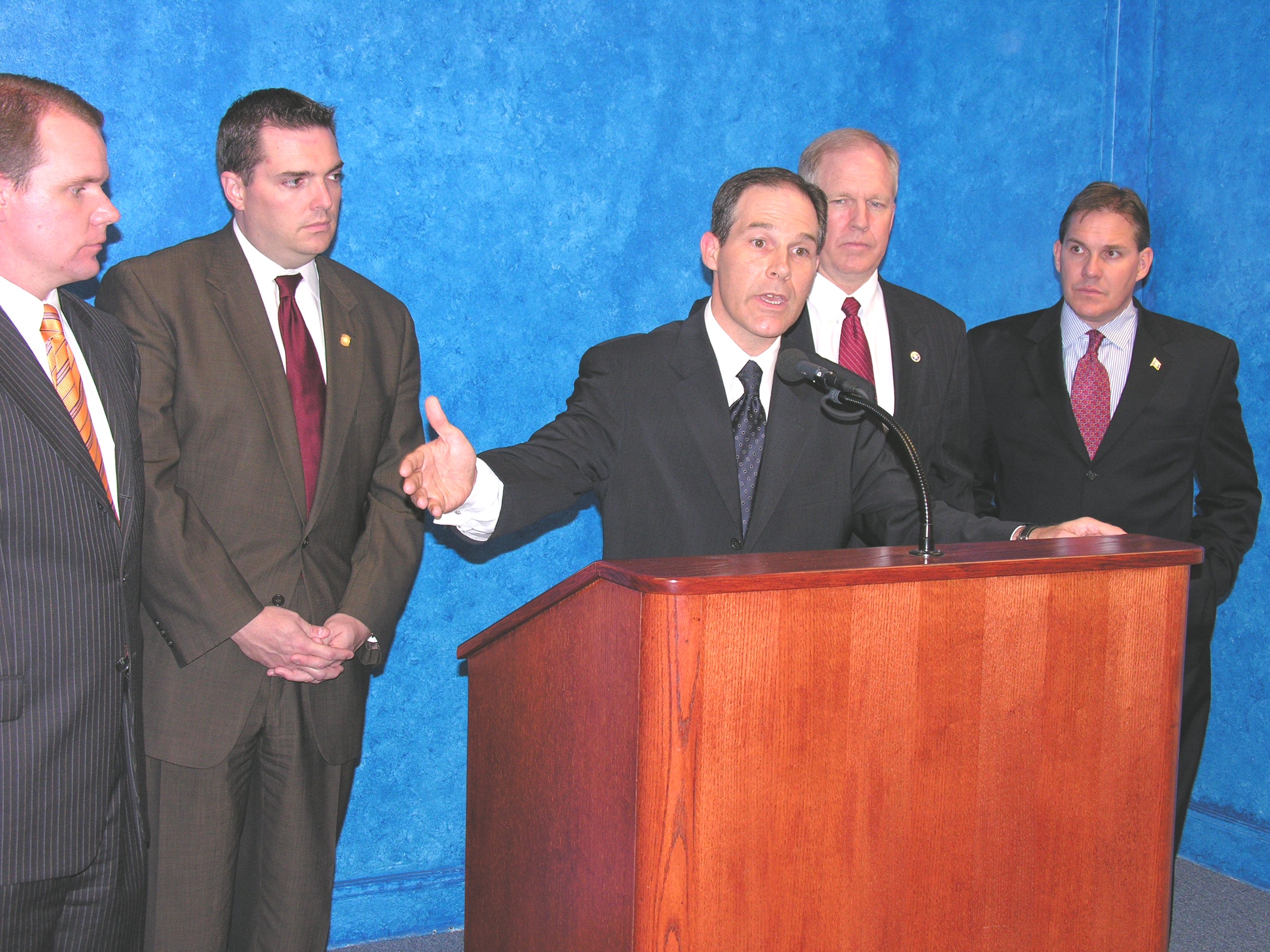 Senator Pruitt discusses SB 2022 as Senators Todd Lamb, Clark Jolley, Owen Laughlin and Cliff Branan look on.