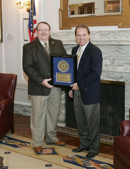 OSBI Director DeWade Langley presents Sen. Jonathan Nichols with the Director's Award for Exemplary Service