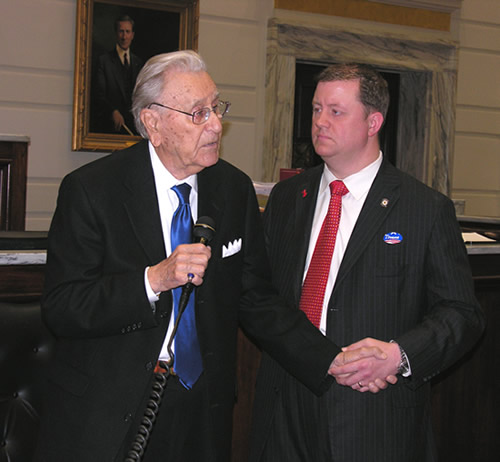 Sen. Dan Newberry listens as Oral Roberts addresses the State Senate.