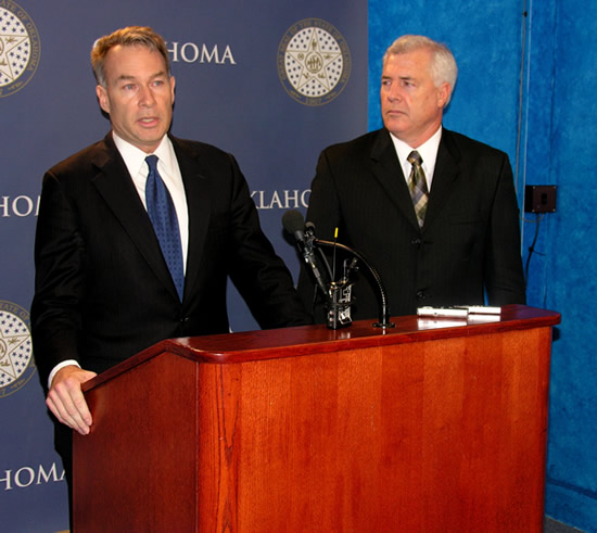 Sen. Jim Reynolds and Rep. Mike Reynolds discuss SJR 5 at the State Capitol Wednesday. 