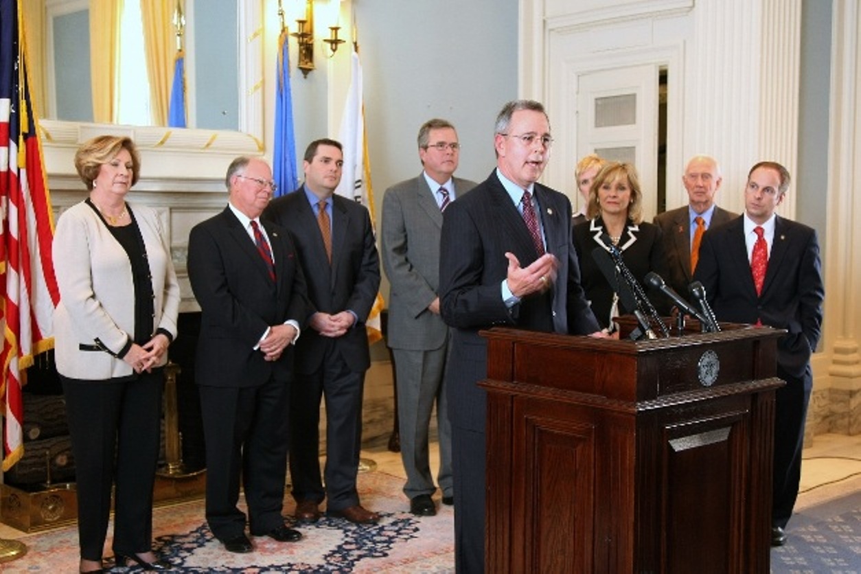 Sen Pres Pro Tem Brian Bingman discusses ed reform initiatives while Gov Fallin and former Florida Gov Bush and other legislators look on