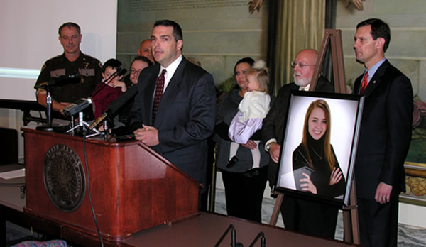 Sen. Clark Jolley, Rep. Jason Nelson, members of the Swezey family and representatives of the Oklahoma Highway Patrol address the media Thursday.