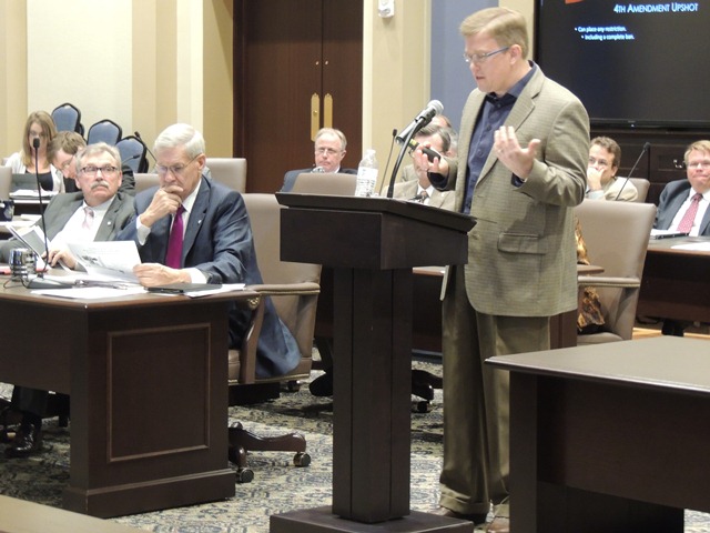 Sen. Frank Simpson listens to OU Law professor Stephen Henderson Wednesday during his drone interim study. 